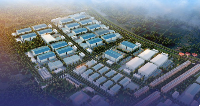 Bán đất cụm công nghiệp Lương Phú Tân Đức Aerial view of a large industrial park with blue-roof warehouses, roads, and surrounding trees, showing a planned campus layout for manufacturing or logistics.